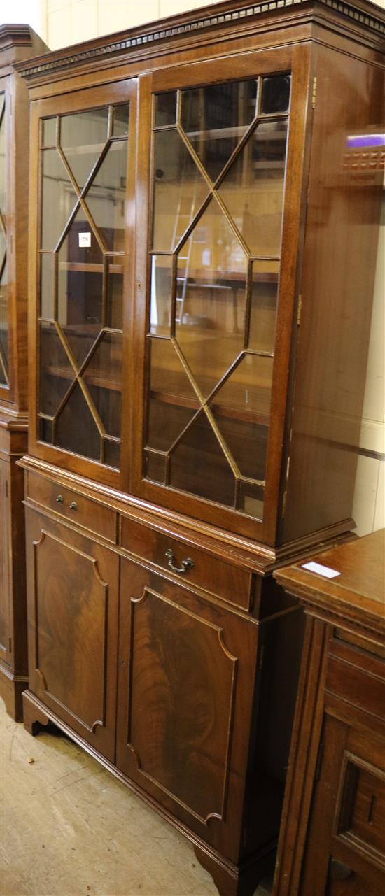 George III style glazed mahogany bookcase cupboard(-)